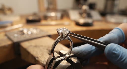 Diamond being set into metal prongs